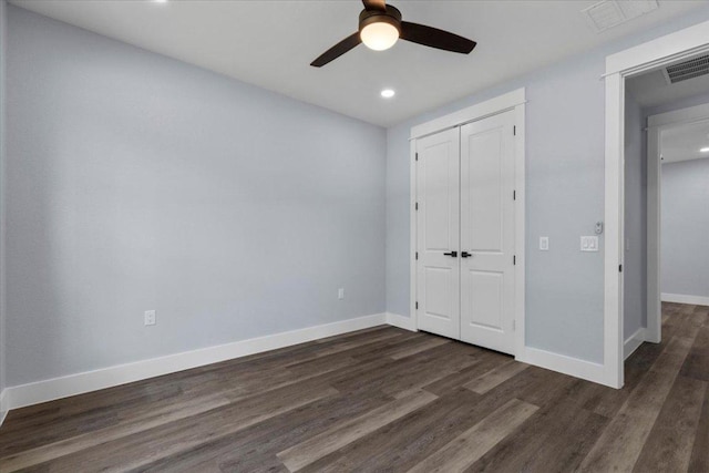 103 W Pauwela Ln, Bastrop, TX 78602 - unfurnished bedroom with dark wood-style flooring, a closet, recessed lighting, and ceiling fan