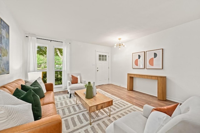 2508 Baxter Dr, Austin, TX 78745 - living room with a chandelier and light wood-style flooring