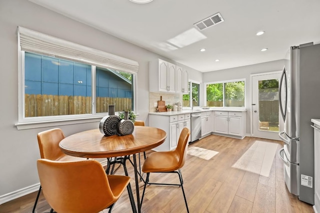 2508 Baxter Dr, Austin, TX 78745 - dining area with plenty of natural light, recessed lighting, and light wood-type flooring