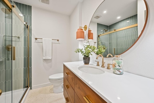 2508 Baxter Dr, Austin, TX 78745 - full bath featuring vanity, a shower stall, speckled floor, and recessed lighting