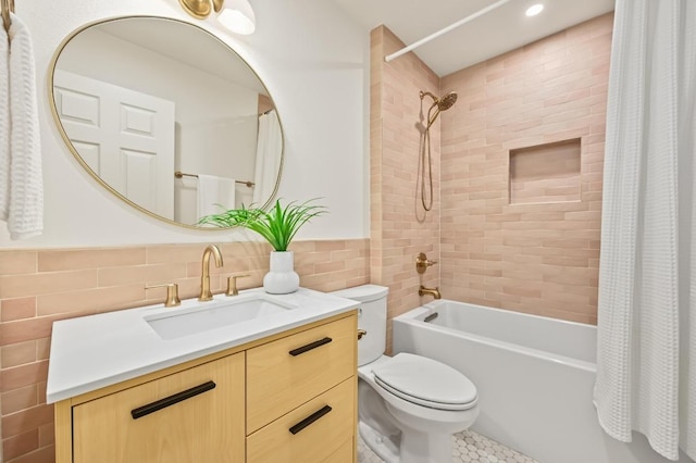 2508 Baxter Dr, Austin, TX 78745 - bathroom featuring tile walls, shower / tub combo with curtain, vanity, and recessed lighting