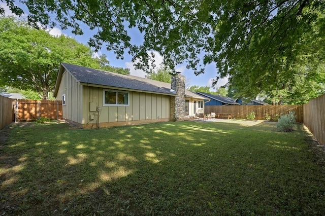 2508 Baxter Dr, Austin, TX 78745 - rear view of property with board and batten siding, a chimney, a fenced backyard, and a patio