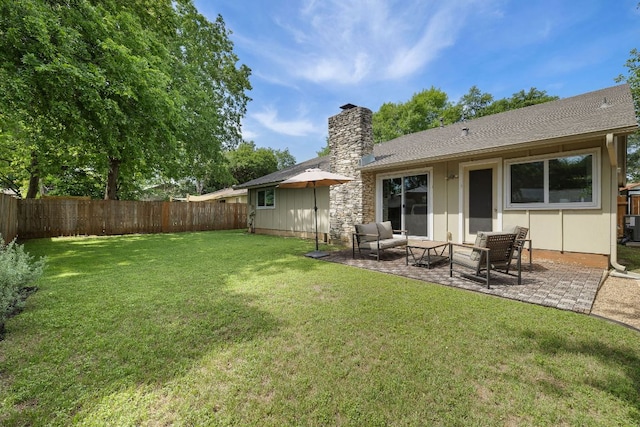 2508 Baxter Dr, Austin, TX 78745 - fenced backyard featuring a patio and an outdoor living space