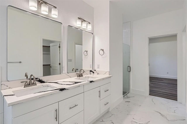 343 Nene Ln, Bastrop, TX 78602 - full bath with double vanity, a stall shower, and marble finish floors