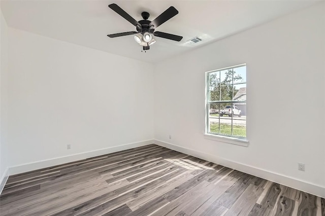 343 Nene Ln, Bastrop, TX 78602 - unfurnished room featuring wood finished floors and a ceiling fan