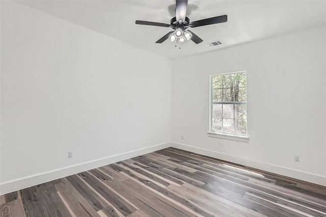 343 Nene Ln, Bastrop, TX 78602 - empty room with dark wood-style floors and ceiling fan