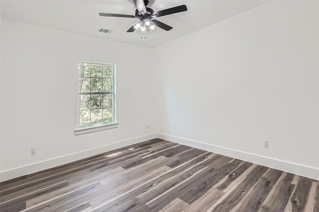 343 Nene Ln, Bastrop, TX 78602 - unfurnished room with dark wood finished floors and ceiling fan