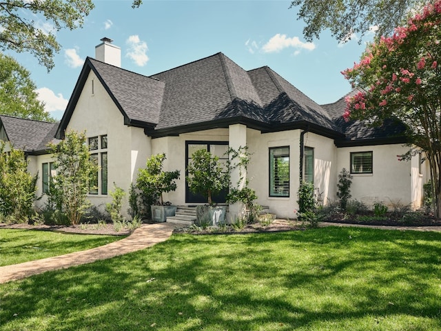 4105 Mcbrine Pl, Austin, TX 78746 - french provincial home with stucco siding, a chimney, roof with shingles, and a front yard