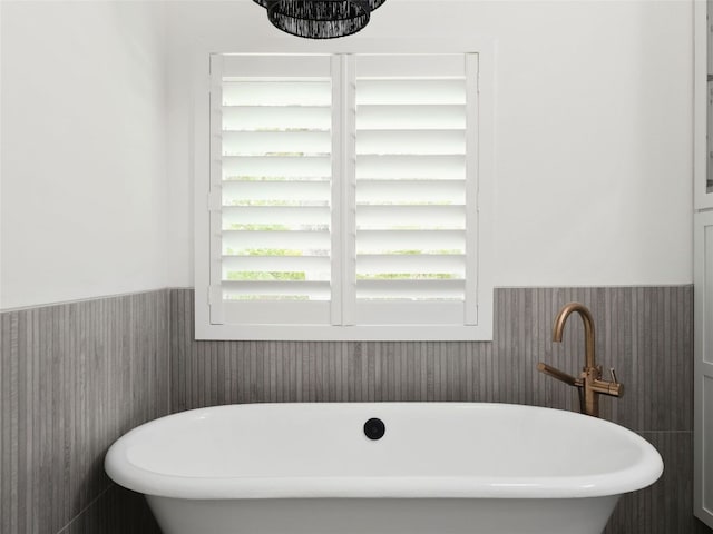 4105 Mcbrine Pl, Austin, TX 78746 - bathroom with a soaking tub and wainscoting