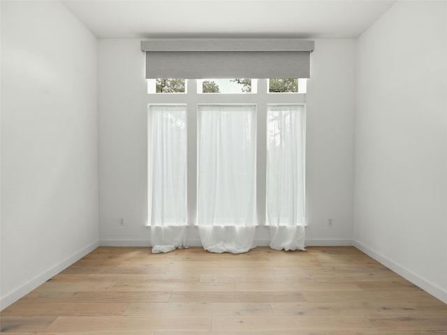 4105 Mcbrine Pl, Austin, TX 78746 - spare room featuring light wood-style flooring and baseboards