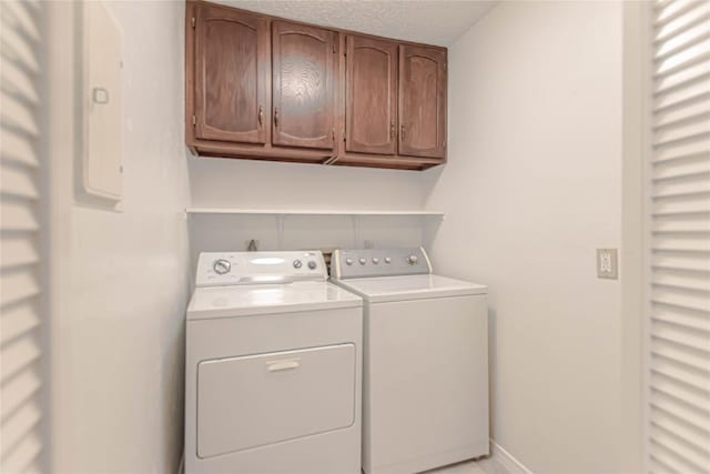 2008 Sandberg Dr, Austin, TX 78752 - laundry area featuring cabinet space and washer and clothes dryer