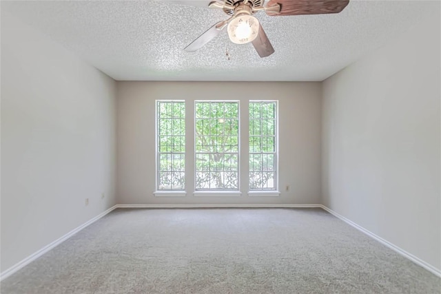 2008 Sandberg Dr, Austin, TX 78752 - unfurnished room featuring carpet, a textured ceiling, and a ceiling fan