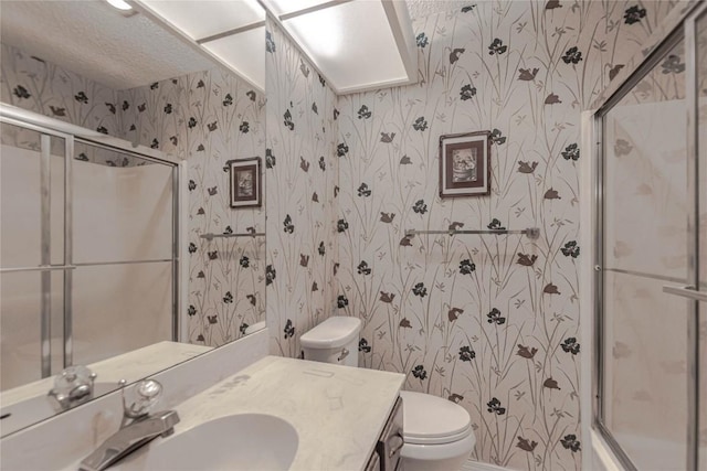 2008 Sandberg Dr, Austin, TX 78752 - full bath featuring wallpapered walls, an enclosed shower, and vanity