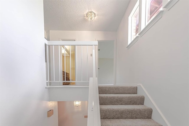2008 Sandberg Dr, Austin, TX 78752 - stairway with a textured ceiling