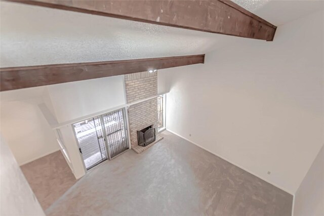 2008 Sandberg Dr, Austin, TX 78752 - unfurnished living room featuring carpet and a fireplace