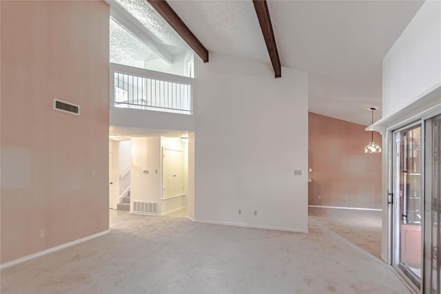 2008 Sandberg Dr, Austin, TX 78752 - unfurnished living room with carpet flooring, high vaulted ceiling, beam ceiling, and stairs