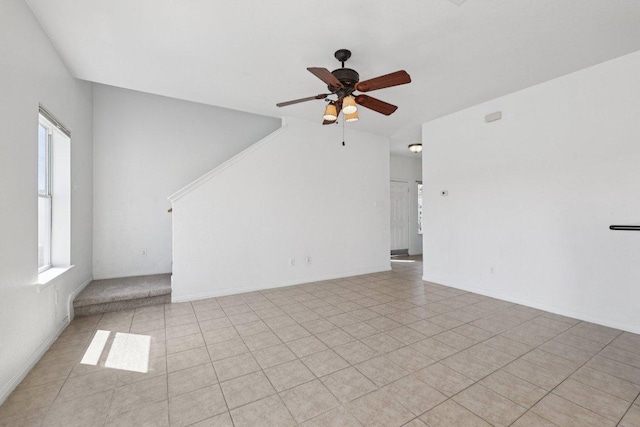 1900 Little Elm Trl Unit 98, Cedar Park, TX 78613 - unfurnished living room featuring a ceiling fan and stairs