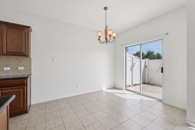 1900 Little Elm Trl Unit 98, Cedar Park, TX 78613 - unfurnished dining area with a chandelier and light tile patterned floors