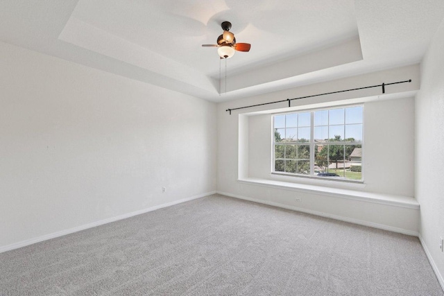 1900 Little Elm Trl Unit 98, Cedar Park, TX 78613 - unfurnished room with a raised ceiling, carpet floors, and ceiling fan