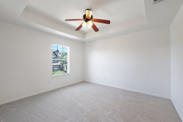 1900 Little Elm Trl Unit 98, Cedar Park, TX 78613 - empty room featuring carpet flooring, a raised ceiling, and ceiling fan