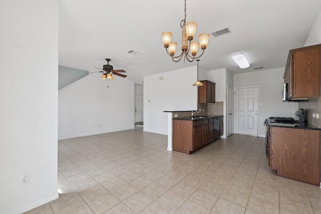 1900 Little Elm Trl Unit 98, Cedar Park, TX 78613 - kitchen with dark countertops, black gas range oven, a ceiling fan, a chandelier, and open floor plan