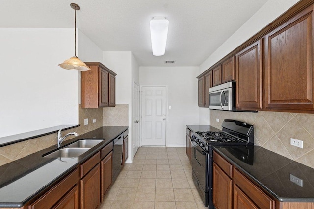 1900 Little Elm Trl Unit 98, Cedar Park, TX 78613 - kitchen featuring black gas range oven, stainless steel microwave, dishwashing machine, tasteful backsplash, and light tile patterned floors