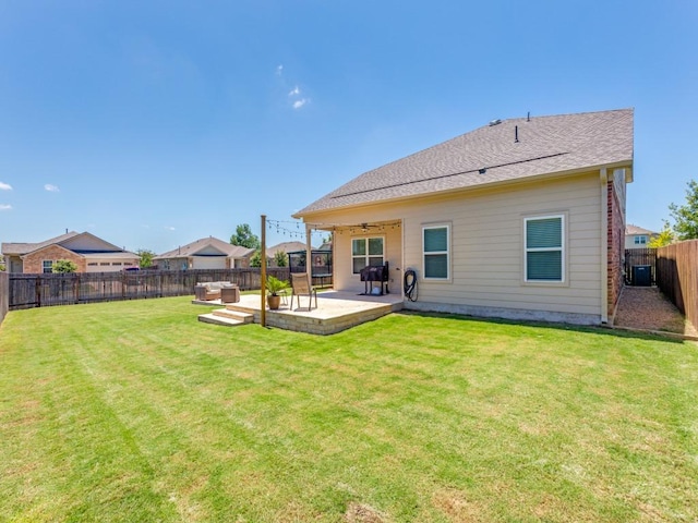 1329 Nokota Bnd, Georgetown, TX 78626 - rear view of house with a fenced backyard, a ceiling fan, a patio area, and a deck
