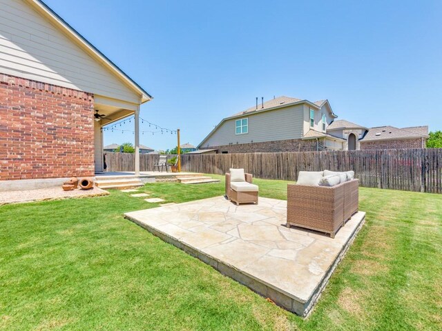 1329 Nokota Bnd, Georgetown, TX 78626 - fenced backyard with a patio and a ceiling fan