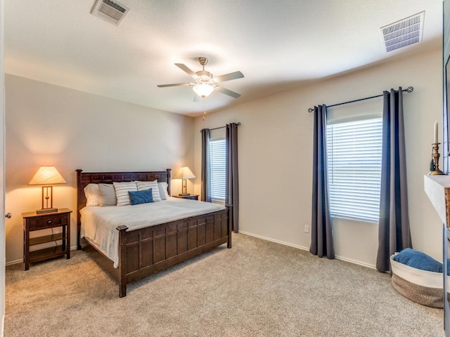 1329 Nokota Bnd, Georgetown, TX 78626 - bedroom with multiple windows, light carpet, and ceiling fan