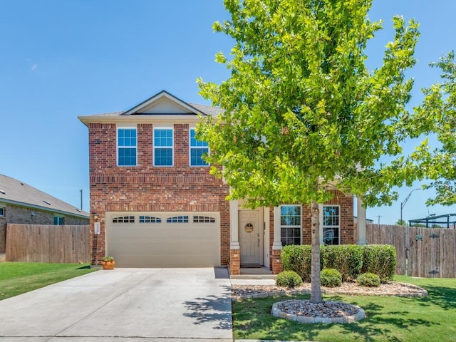 1329 Nokota Bnd, Georgetown, TX 78626 - view of front of house with concrete driveway, a garage, and brick siding