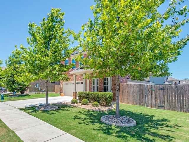 1329 Nokota Bnd, Georgetown, TX 78626 - obstructed view of property with concrete driveway, brick siding, and an attached garage