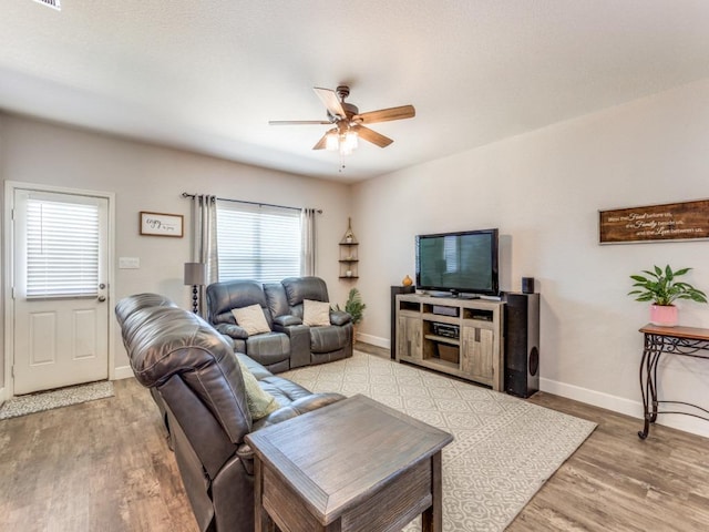 1329 Nokota Bnd, Georgetown, TX 78626 - living area with a ceiling fan and light wood-style flooring