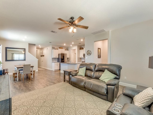1329 Nokota Bnd, Georgetown, TX 78626 - living room with light wood-type flooring, a ceiling fan, and recessed lighting