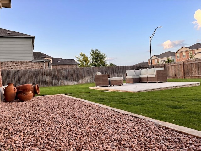 1329 Nokota Bnd, Georgetown, TX 78626 - fenced backyard featuring a patio area, an outdoor hangout area, and a residential view