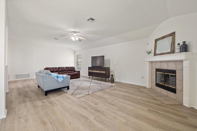 1643 Abbey Ln, Cedar Park, TX 78613 - living room with ceiling fan, wood finished floors, a fireplace, and vaulted ceiling