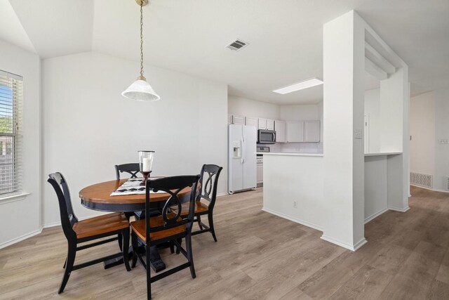 1643 Abbey Ln, Cedar Park, TX 78613 - dining space featuring light wood finished floors and lofted ceiling
