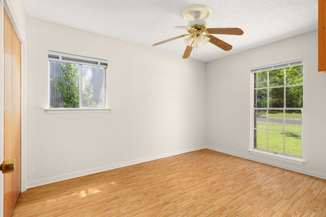 6804 Miranda Dr, Austin, TX 78752 - unfurnished room featuring light wood-style floors, a ceiling fan, and a textured ceiling