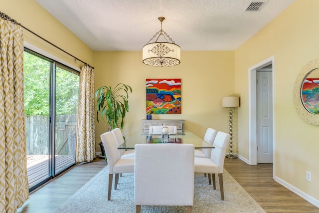 5808 Abilene Trl, Austin, TX 78749 - dining room with wood finished floors and a textured ceiling