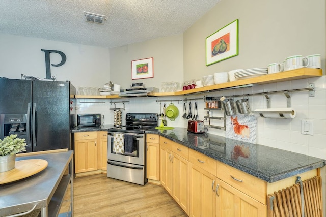5808 Abilene Trl, Austin, TX 78749 - kitchen featuring open shelves, black appliances, tasteful backsplash, light wood-style floors, and a textured ceiling