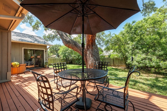 5808 Abilene Trl, Austin, TX 78749 - wooden deck with a fenced backyard and outdoor dining area