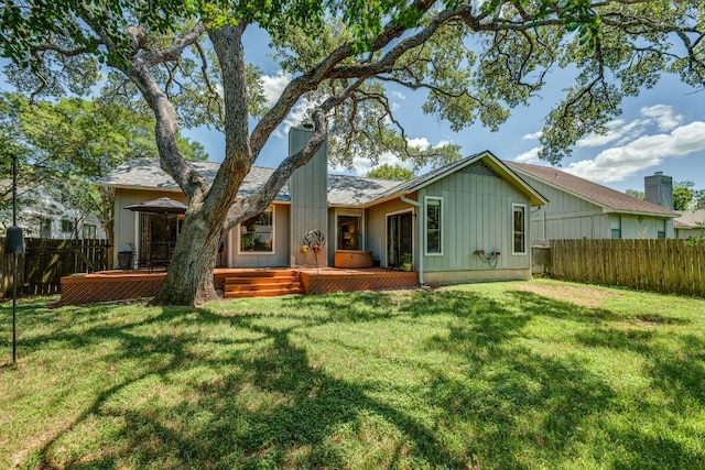 5808 Abilene Trl, Austin, TX 78749 - rear view of house featuring a fenced backyard and a wooden deck