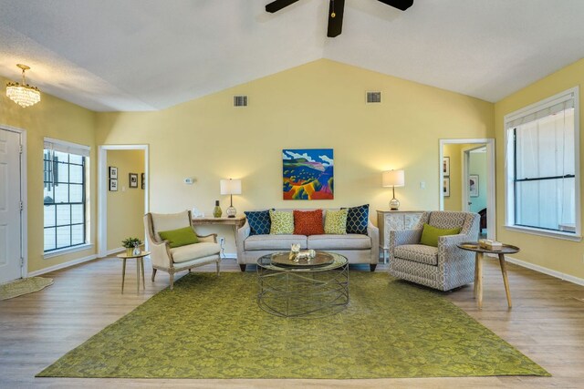 5808 Abilene Trl, Austin, TX 78749 - living area with wood finished floors, ceiling fan, and lofted ceiling