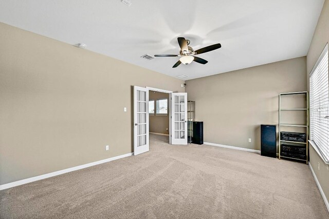 318 Gaspar Bnd, Cedar Park, TX 78613 - unfurnished bedroom featuring french doors, carpet flooring, and a ceiling fan