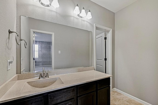 318 Gaspar Bnd, Cedar Park, TX 78613 - bathroom with vanity and baseboards