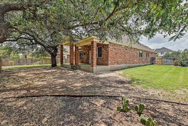 318 Gaspar Bnd, Cedar Park, TX 78613 - view of property exterior with brick siding and a fenced backyard