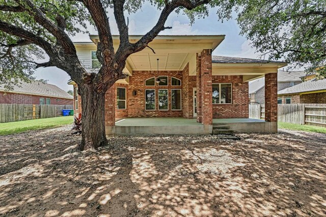 318 Gaspar Bnd, Cedar Park, TX 78613 - rear view of property featuring brick siding