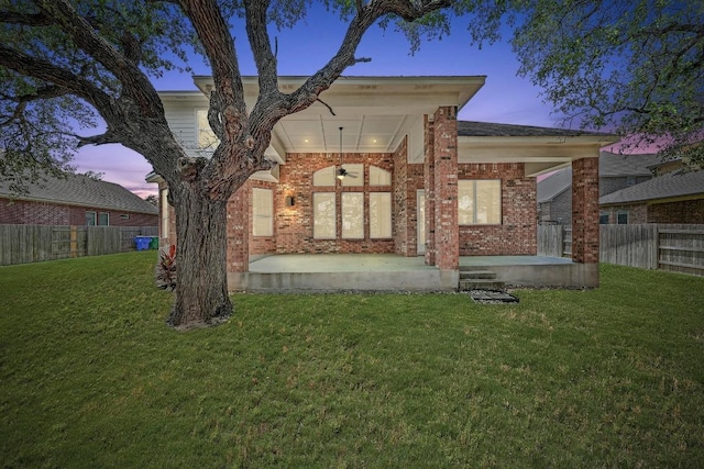 318 Gaspar Bnd, Cedar Park, TX 78613 - back of property with brick siding, a ceiling fan, and a fenced backyard