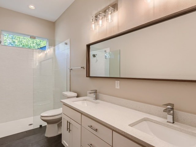7204 Bennett Ave Unit A, Austin, TX 78752 - full bathroom with double vanity, a walk in shower, tile patterned floors, and recessed lighting