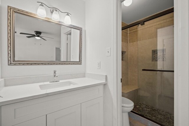 2109 Brandywine Ln, Austin, TX 78727 - full bathroom featuring a stall shower, vanity, and ceiling fan