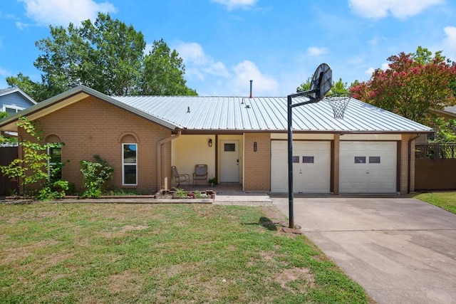 2109 Brandywine Ln, Austin, TX 78727 - ranch-style house featuring a garage, concrete driveway, brick siding, and a metal roof